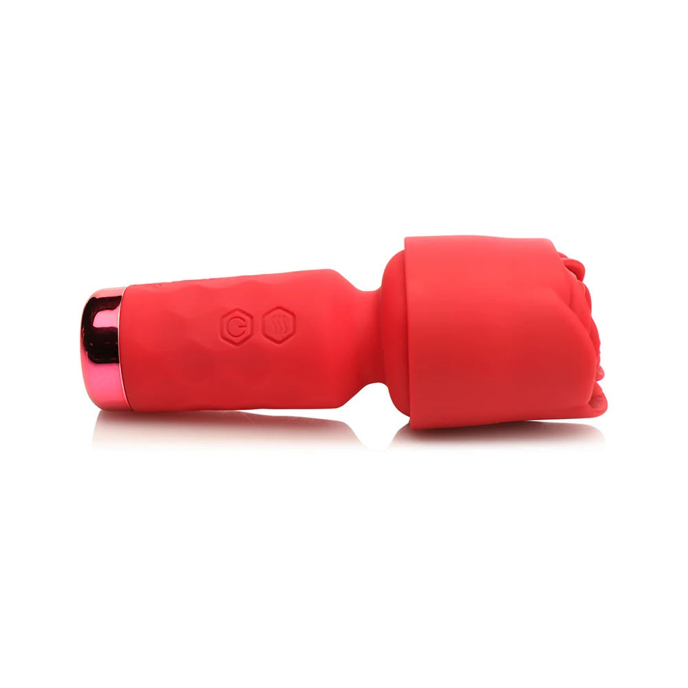 Red Pleasure Rose Mini Wand , with silicone rose cover over the head, laying horizontal to the ground
