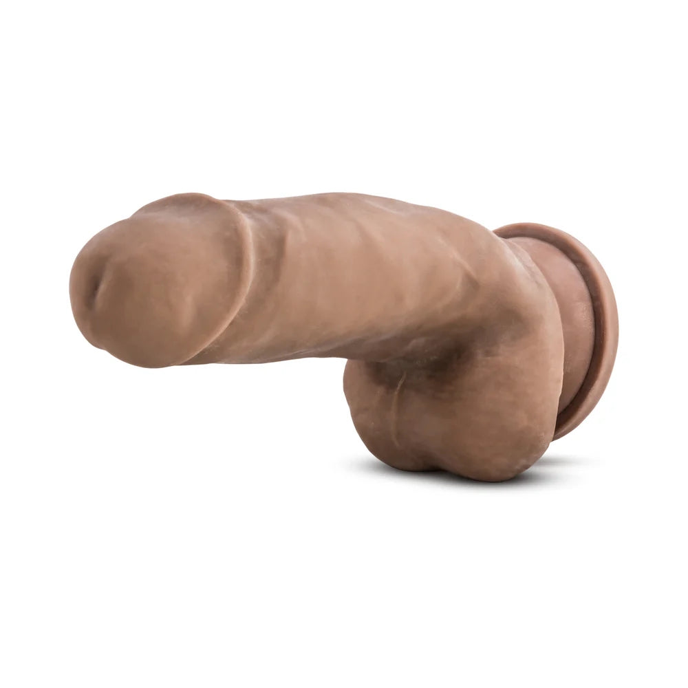 Caramel Au Naturel Fat Boy sensafeel dual density dildo with suction base, horizontal to the ground with the tip facing forward