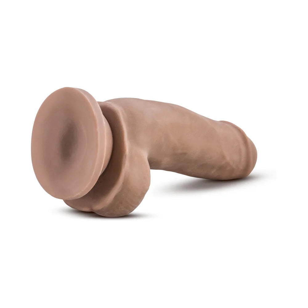 Caramel Au Naturel Fat Boy sensafeel dual density dildo with suction base, horizontal to the ground with suction cup exposed