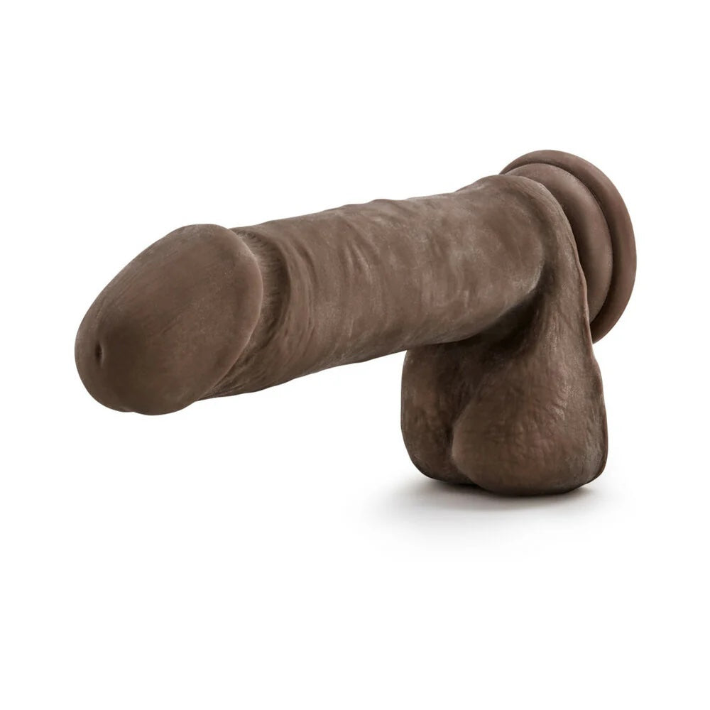 Chocolate Au Naturel Sensafeel dual density dildo with balls and suction cup, horizontal to the ground 3/4 with balls hanging down