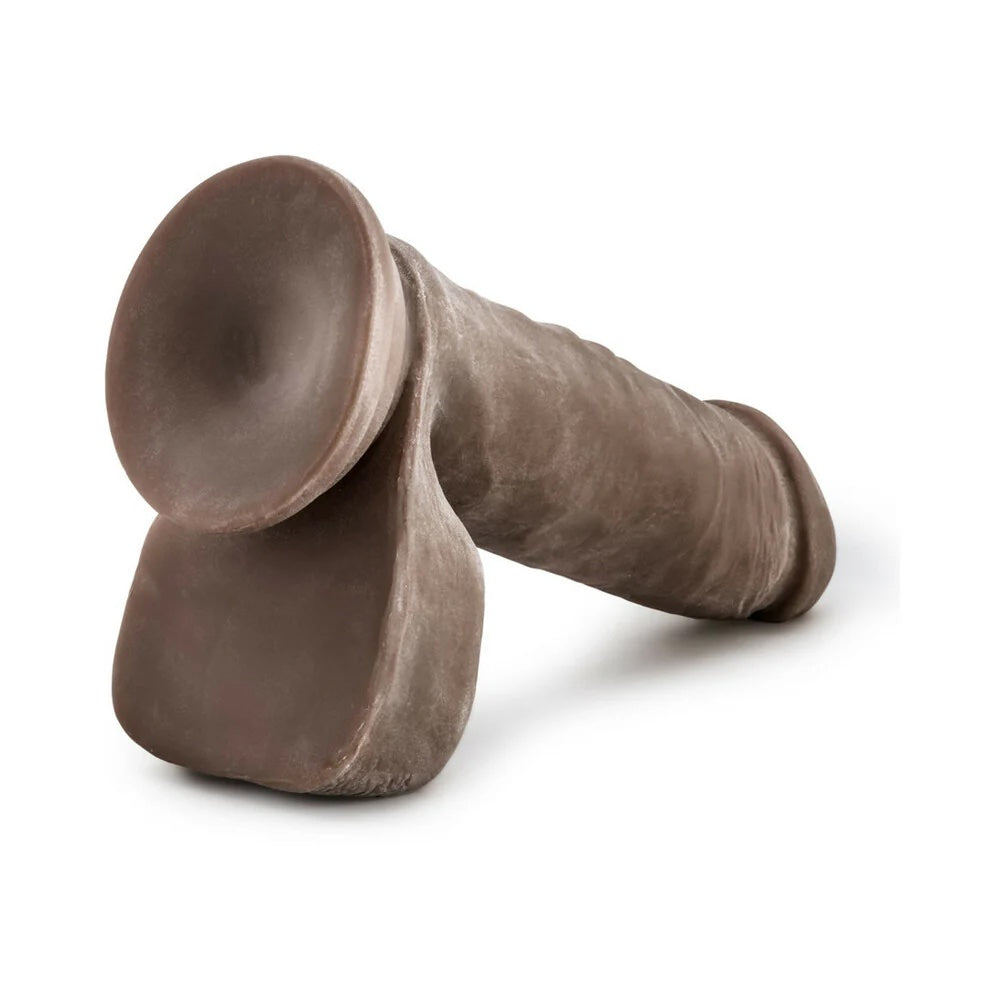 xChocolate Au Naturel Sensafeel dual density dildo with balls and suction cup horizontal to the ground, with the suction cup up to view it