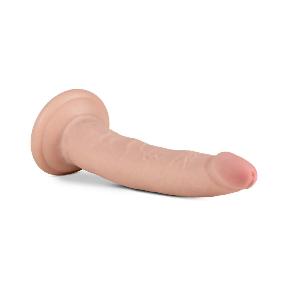 Vanilla Jack Au Naturel slim sensafeel dildo with suction cup horizontal to the ground with the tip facing right