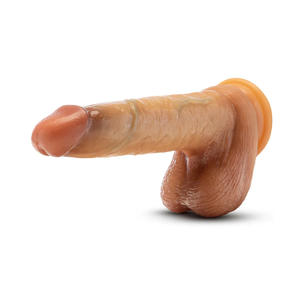 Blush Renaissance Davinci sliding foreskin silicone tan dildo in erect position horizontal to the ground