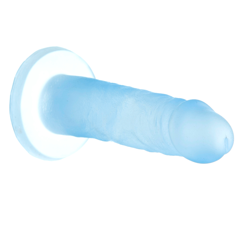 Blue Lagoon Addiction Cocktails silicone dildo laying horizontal to the ground suctioned to a vertical surface