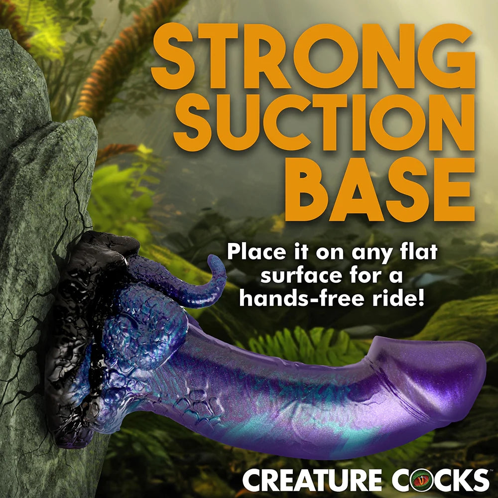 XR creature Cocks Dino Dick dinosaur fantasy dong with mini tail and legs in purple, black and teal suctioned to a vertical surface to display strong suction base