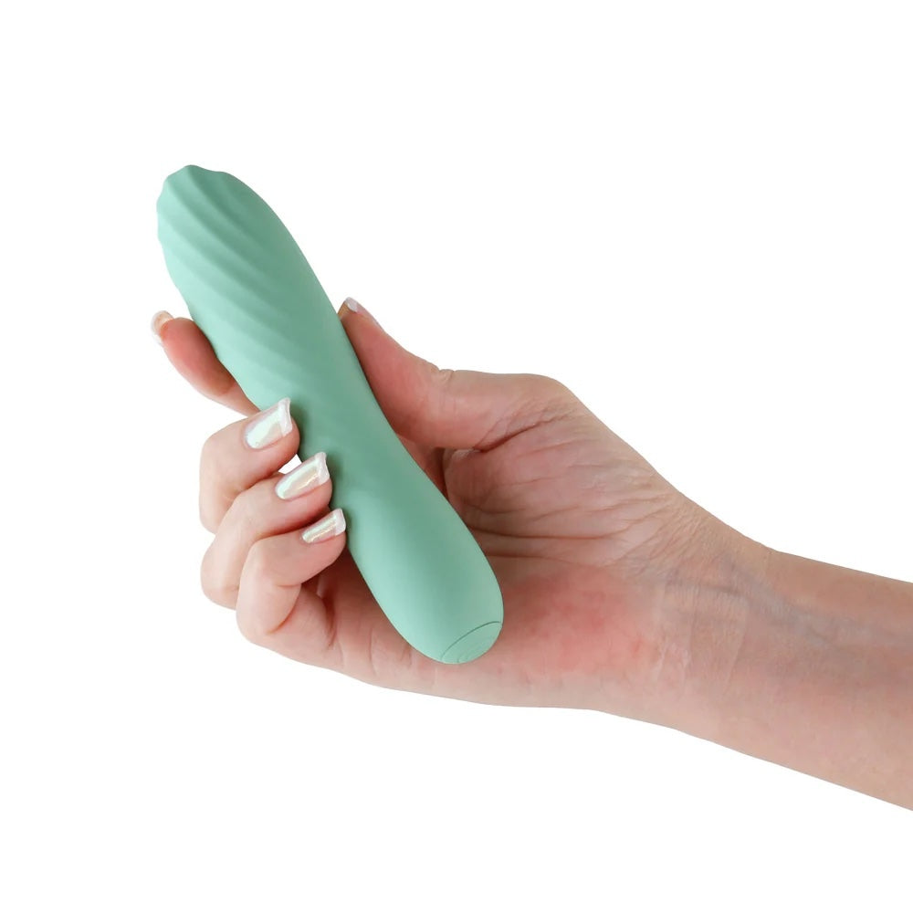Mint Green Destiny by Desire ribbed silicone wand vibrator held in a hand