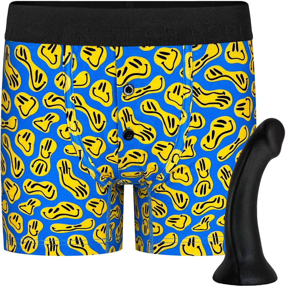 Black Contour silicone dildo from the side, shown with Button fly Boxer smiley print harness option from the front