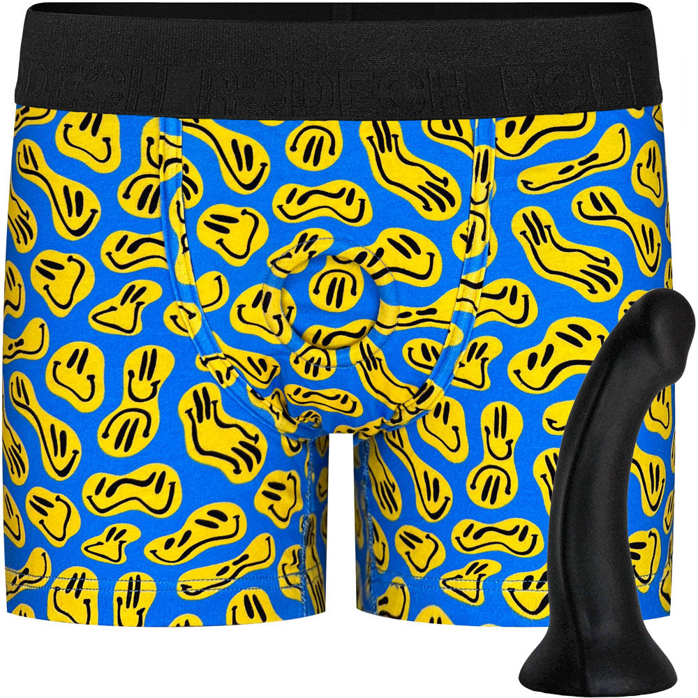 Black Contour silicone dildo from the side, shown with Classic Boxer smiley print harness option from the front