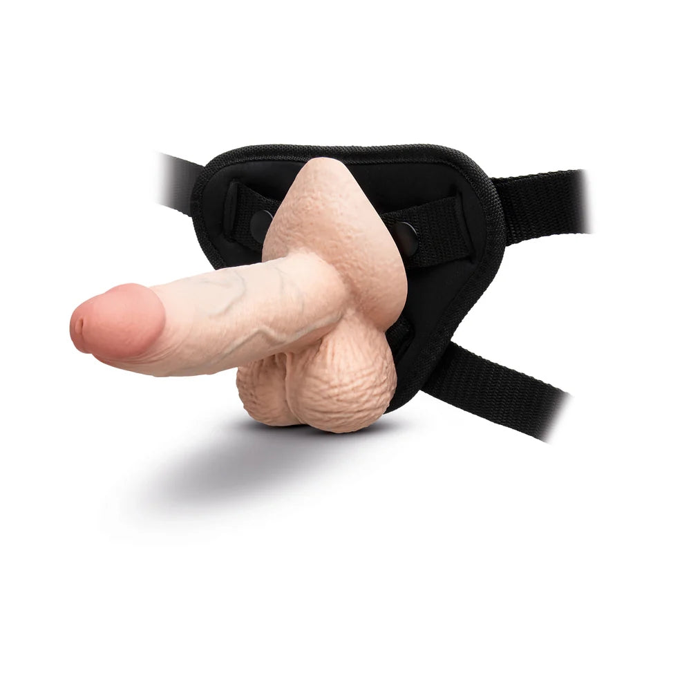 slipskin 6" cream silicone sliding skin dildo, in a strapon harness horizontal to the ground