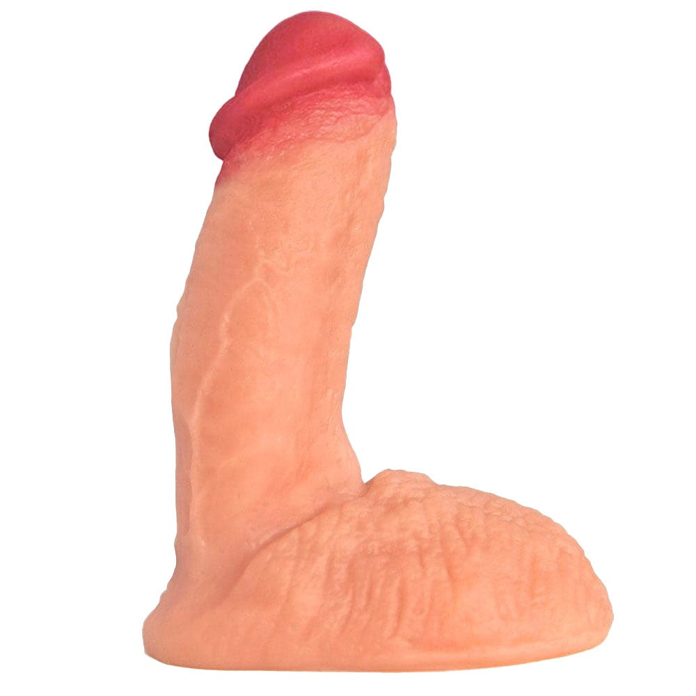 Vanilla colored semi erect 5.5" pacl and play dildo, with balls. Sitting flat on its balls and with pink tip pointed up