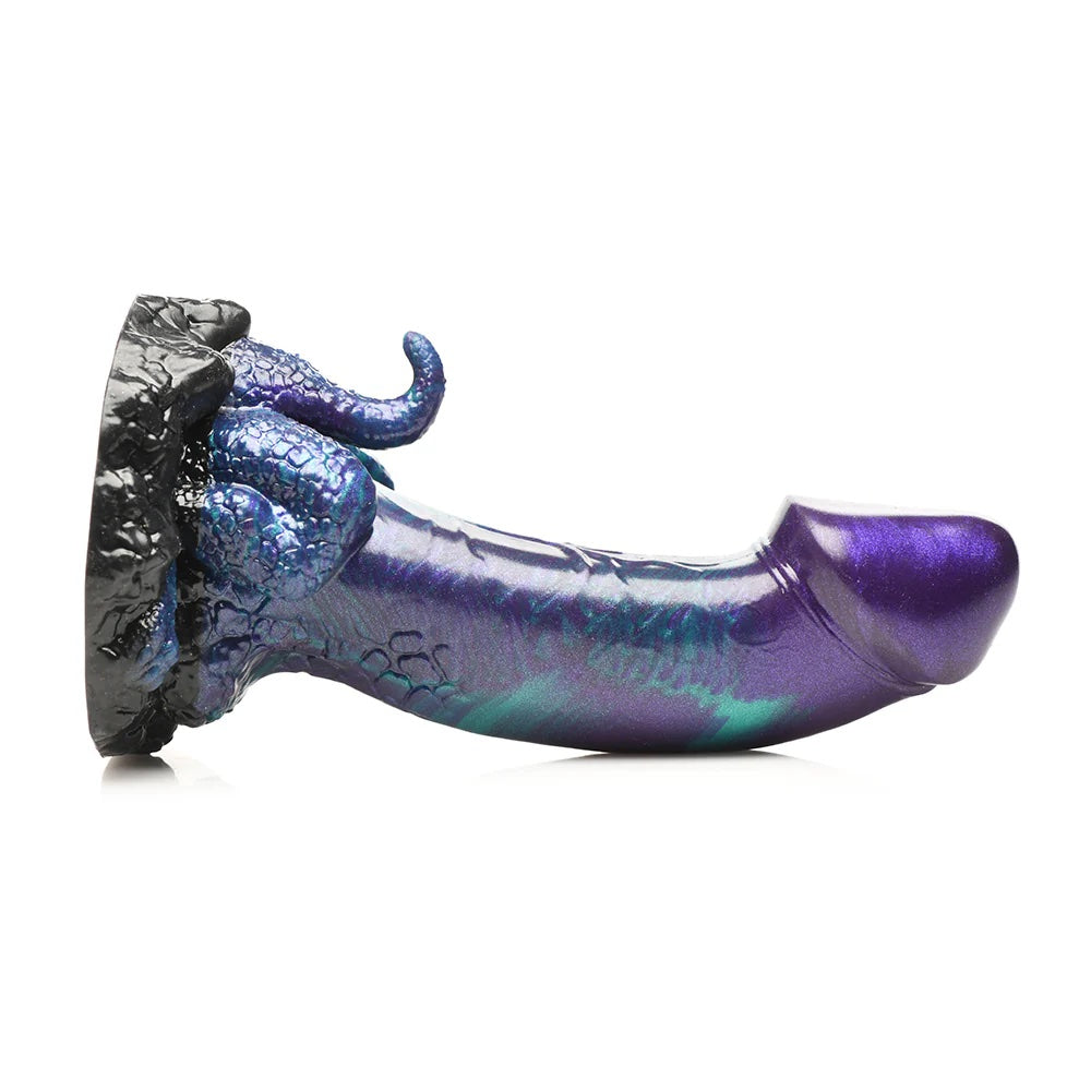 XR creature Cocks Dino Dick dinosaur fantasy dong with mini tail and legs in purple, black and teal laying horizontal to the ground