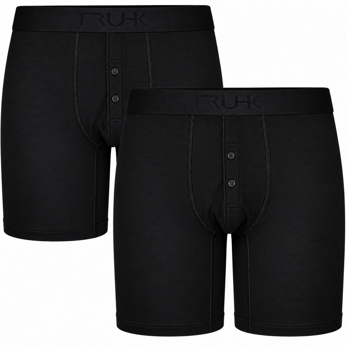 Two black men's boxer briefs shown on a plain white background, with one pair slightly behind the other. The front pair has a button placket and the waistband shows the RUK brand name.
