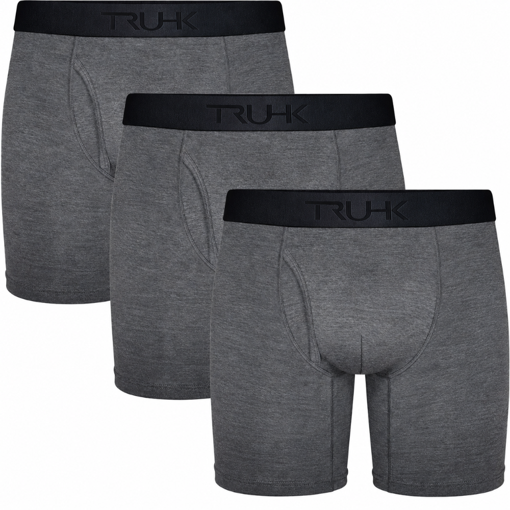 Three pairs of heather gray boxer briefs arranged in a staggered overlapping layout, each with a black waistband featuring the debossed brand name 'TRUHK'.