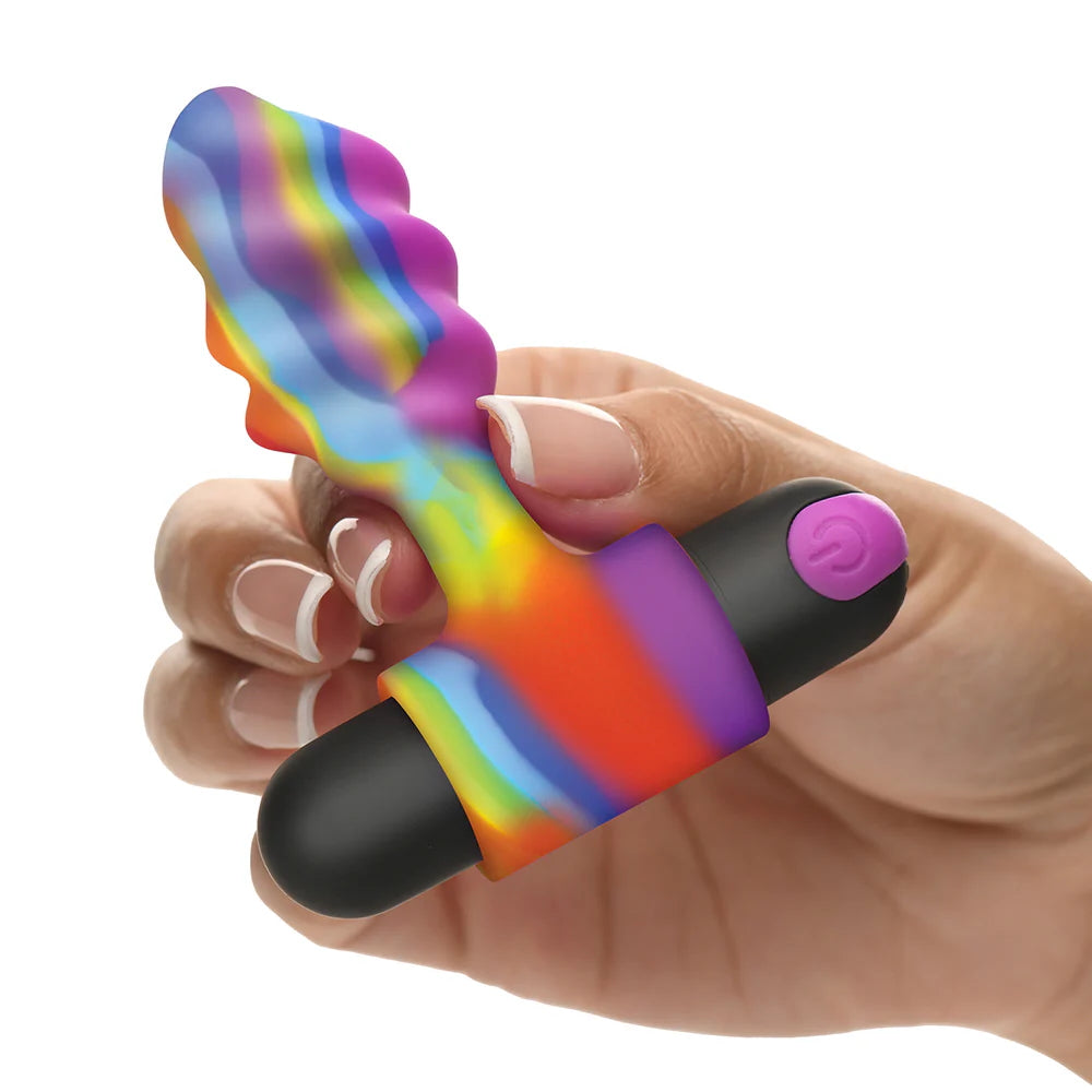 Hand holding the Bang rainbow-colored anal vibrator on a white background