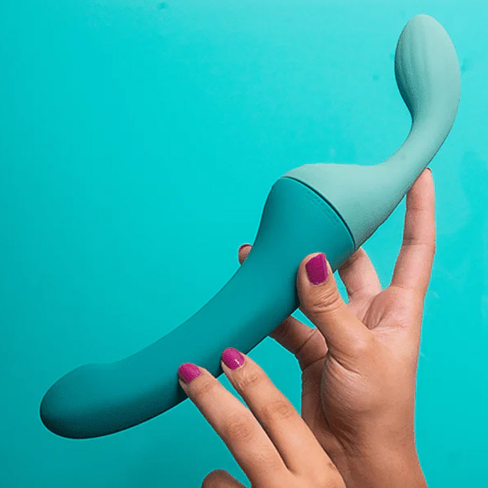 Banana Split customizable couples strapless strap on vibrator with dollop side, and attached banana side, connected  held by 2 hands