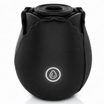 Nexus Vibe Petalpulse black silicone vibrating rose airpulse suction toy from the side, with power button lit up