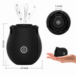 Nexus Vibe Petalpulse blcak silicone vibrating rose airpulse suction toy from the side, and top with  rose sitting on a hand for over size comparison