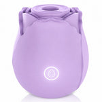 Nexus Vibe Petalpulse lilac silicone vibrating rose airpulse suction toy from the side, with power button lit up