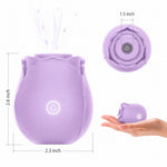 Nexus Vibe Petalpulse lilac silicone vibrating rose airpulse suction toy from the side, with power button lit up, and form top to see opening, and in a hand for over size comparison