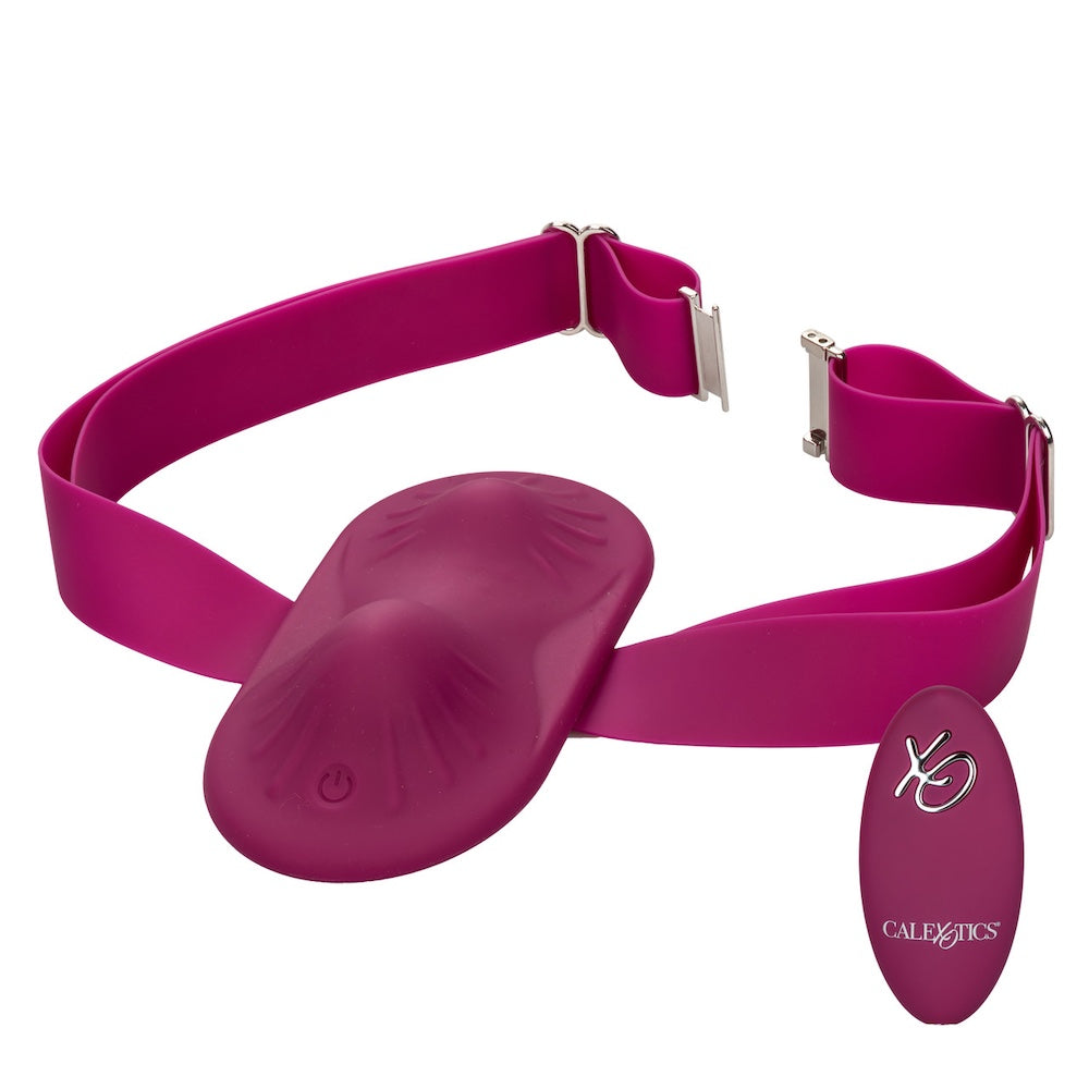 Cal exotics dual rider silicone vibrating grinding pad with thigh strap attached and remote  from the top and front