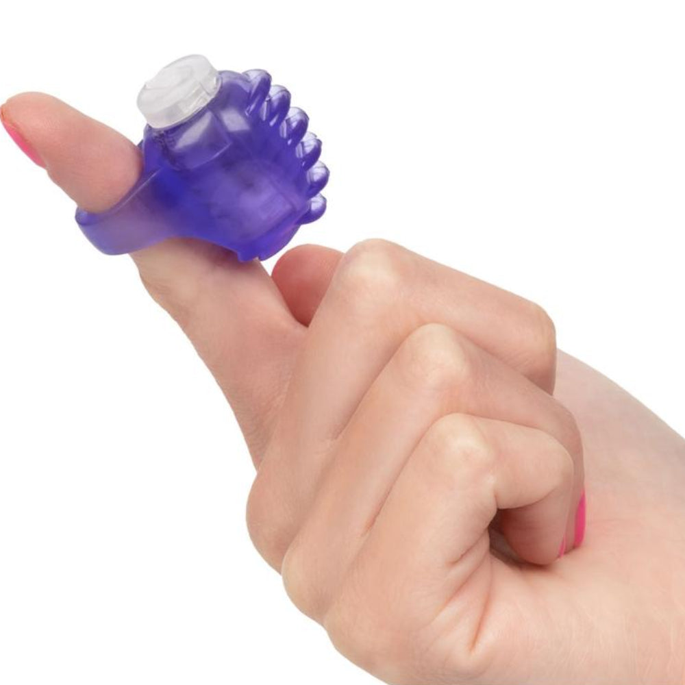 Purple vibrating finger teaser clitoral stimulation toy by cal exotics on a finger