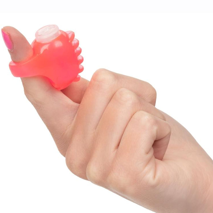 pink vibrating finger teaser clitoral stimulation toy by cal exotics on a finger