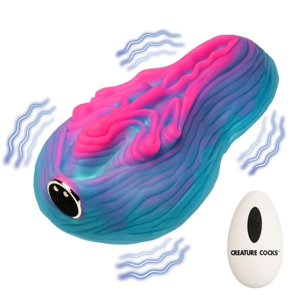 Creature Cocks Vulvaron pink and blue silicone vulva- like fantasy vibrating rechargeable remote controlled silicone grinder with remote and vibration lines
