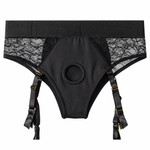 Crotchless open back lave panty harness with removable garter straps laid flat form the front