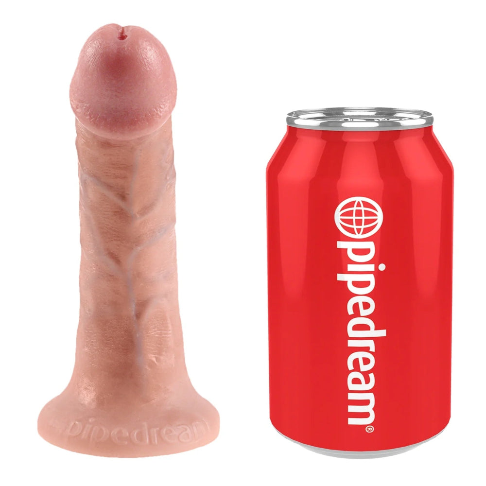 King cock 6" Vanilla RealDeal PVC dildo with painted veins and tip, standing on its base next to a standard soft drink can for size reference