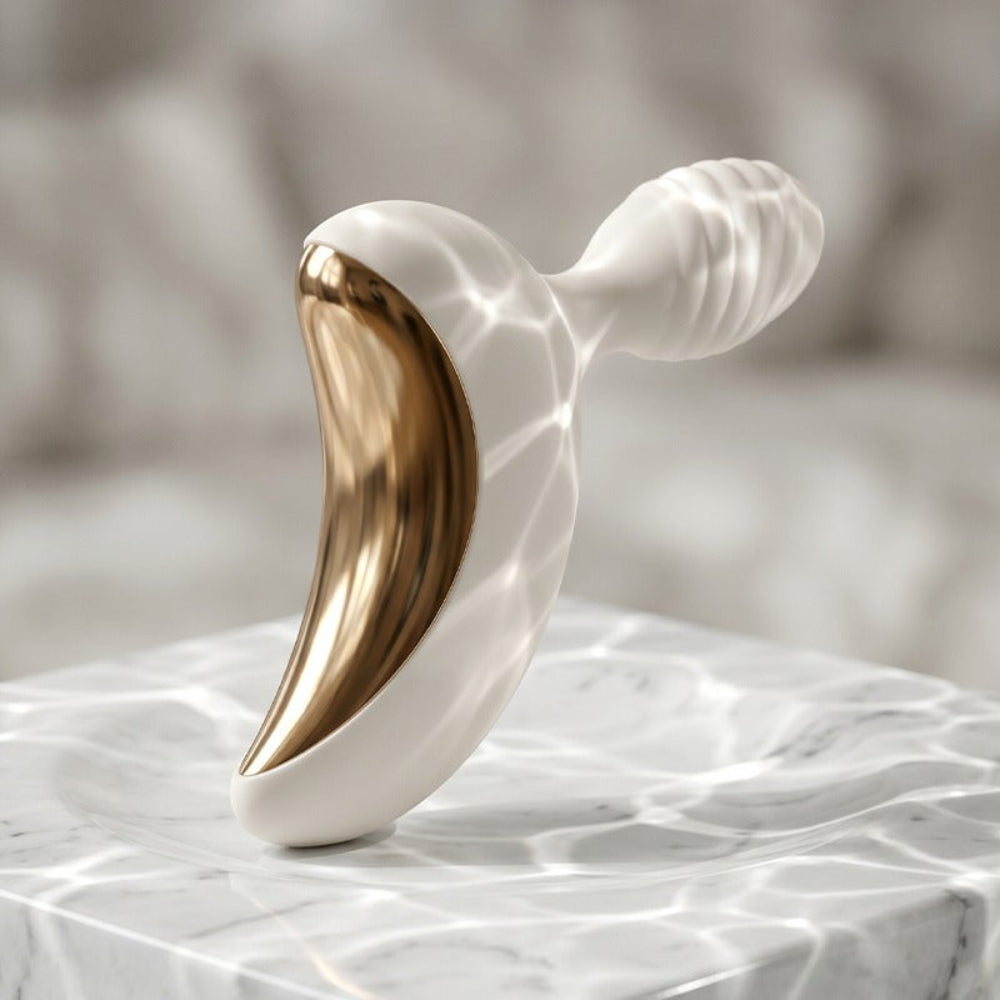 Lunar Curve silicone crescent moon shaped clitoral vibrator in white and gold with app control capability, from the side and back
