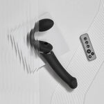 Strap on me multi orgasm strapless strap on vibrator in black in size large, from the side with wireless remote 