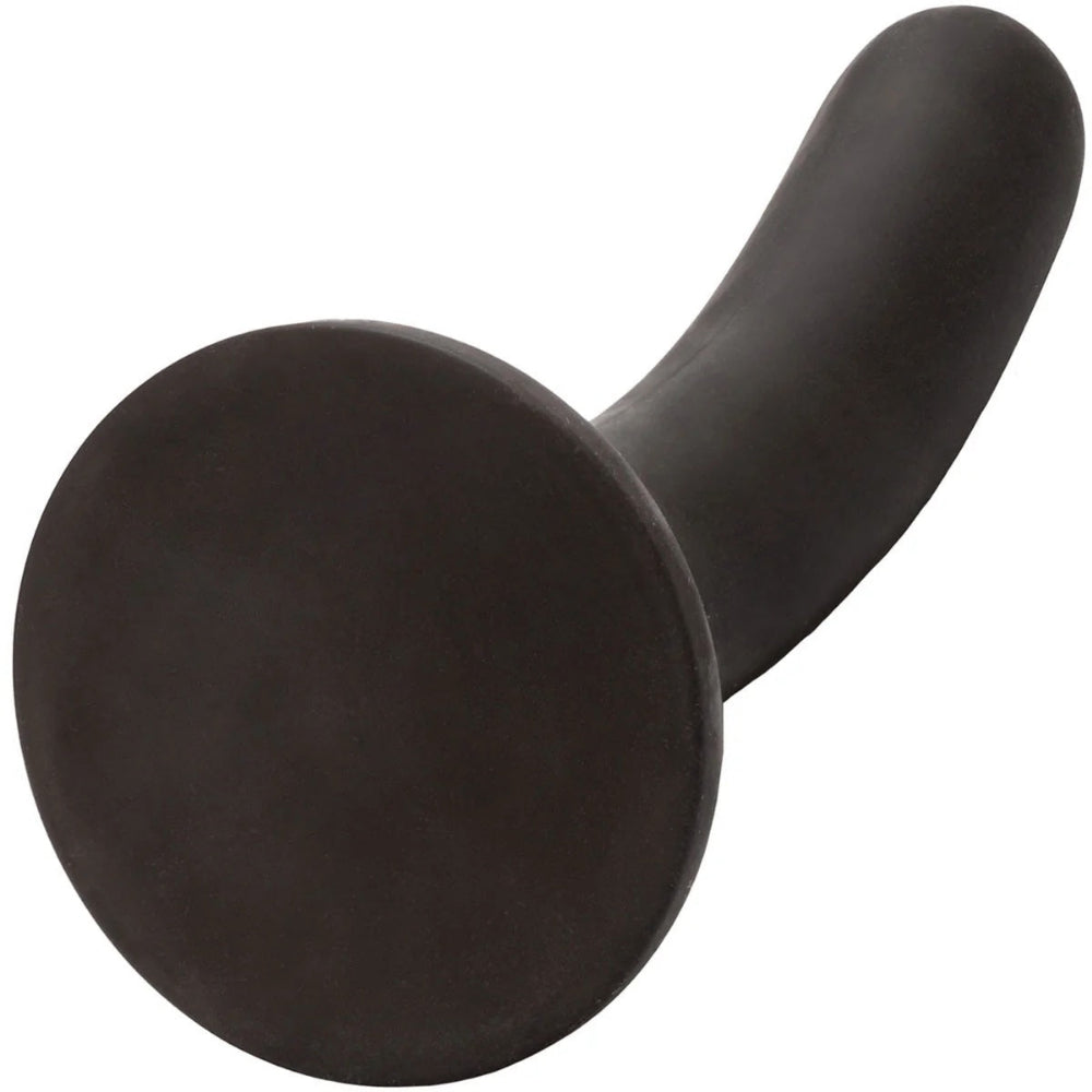 Nexus Silicone Pip 6 inch black firm silicone dildo from the bttom with suction cup tilted up to view underneath