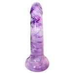 Nexus Sol dildo in firm silicone, in berry shake, a white and purple swirl color way, from the back, flat on it's suction base, with the underside  of the shaft or back 