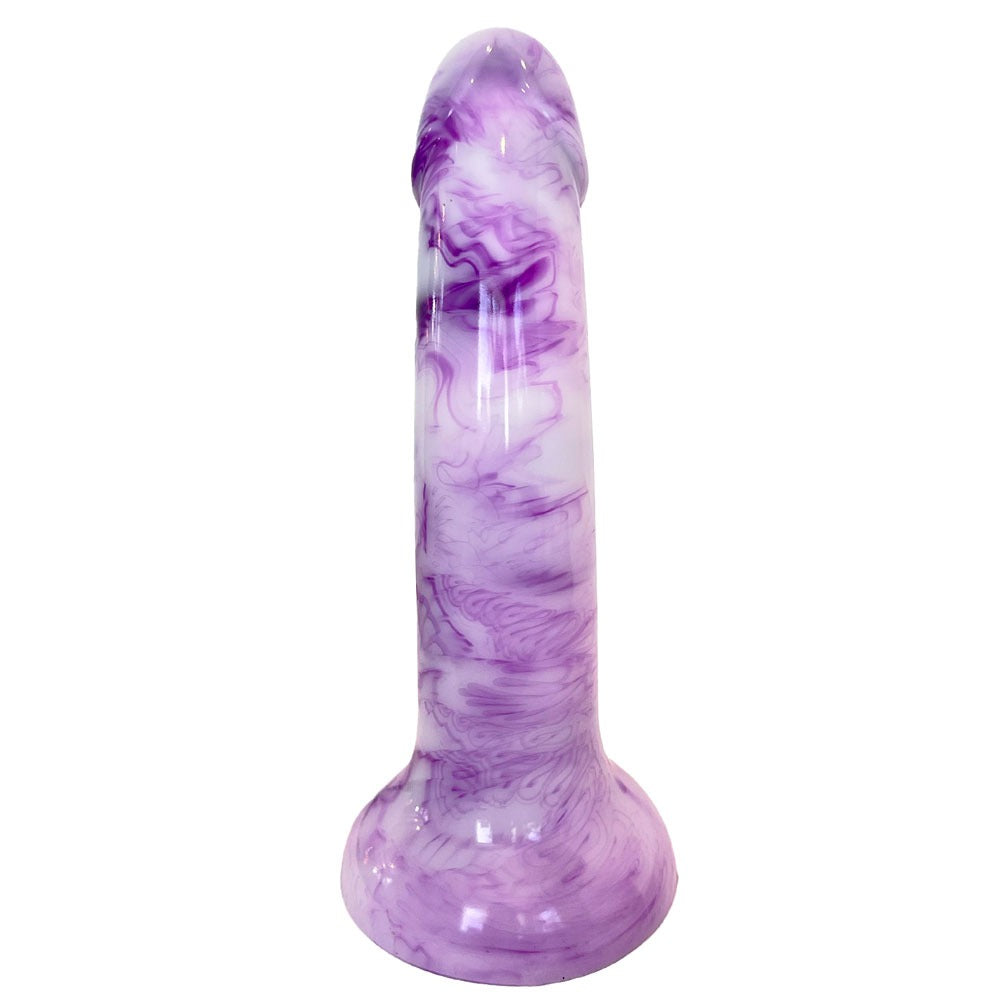Nexus Sol dildo in firm silicone, in berry shake, a white and purple swirl color way, from the back, flat on it's suction base, with the underside  of the shaft or back 