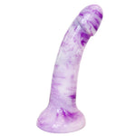 Nexus Sol dildo in firm silicone, in berry shake, a white and purple swirl color way, from the side flat on it's suction base