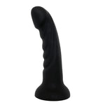 Nexus Tease Silicone ribbed dildo wth suction cup base, flat on its base from the side, with the tip towards the left.