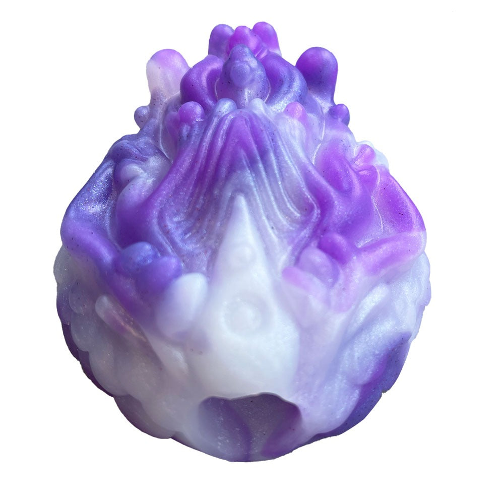 Pris toys tribble silicone fantasy grinder dildo cushion in amethyst, a swirls of 3 shades of purple, from the top front to show bullet vibe hole