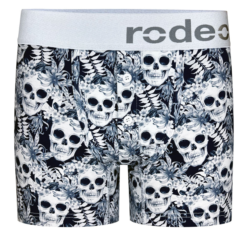 A pair of harness boxer briefs with a button fly front, featuring a pattern of black and white skulls by rodeoh.