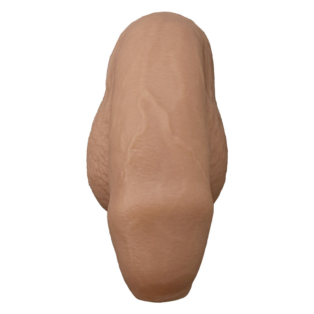 Nexus silicone foreman, uncut silicone packers in caramel, in flaccid position from the front 