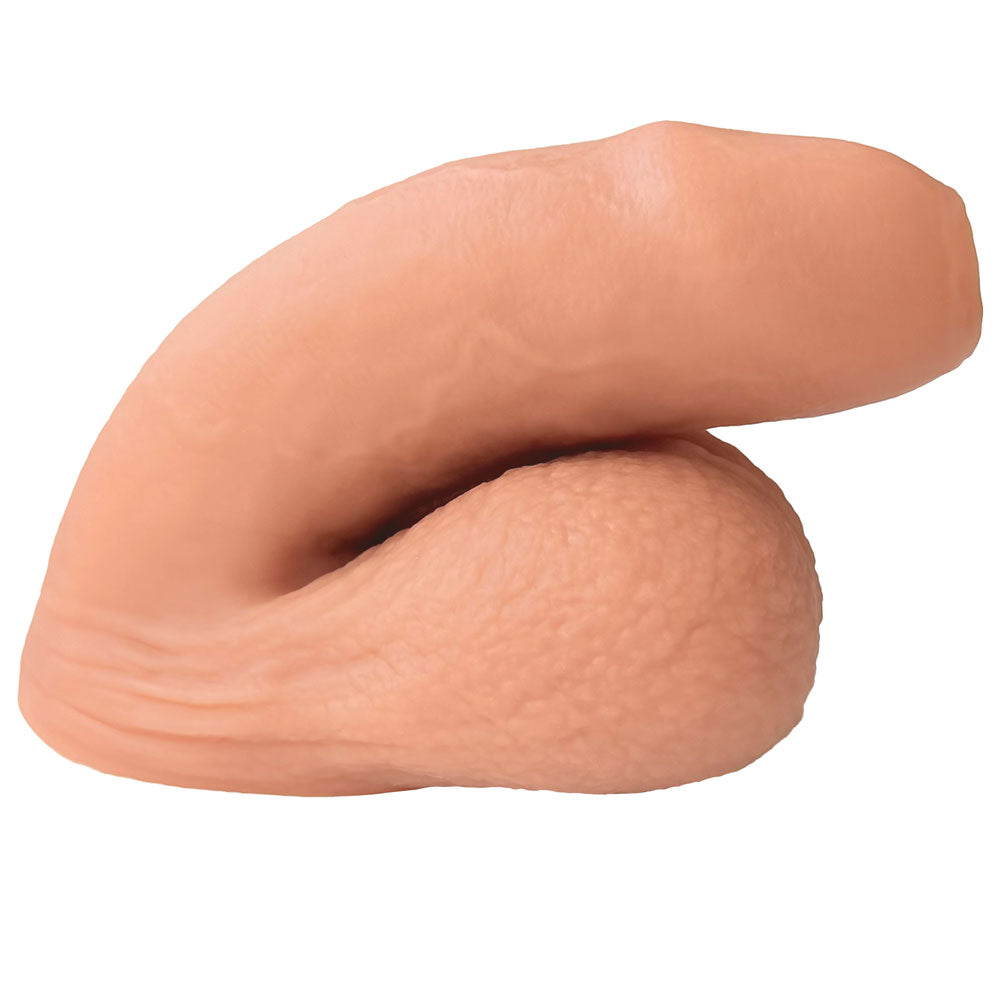 Nexus silicone foreman, uncut silicone packers in caramel and vanilla, in flaccid position from the side 3 
