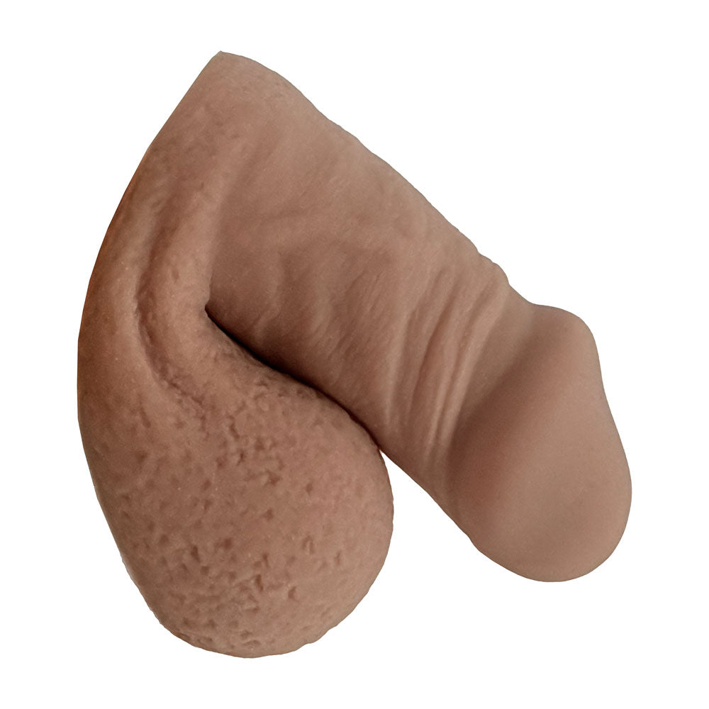 Freeform extra small FTM soft silicone 3 inch packer, in the flaccid packed position from the side, in caramel color