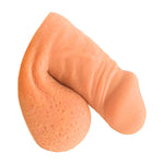 Freeform extra small FTM soft silicone 3 inch packer, in the flaccid packed position from the side, in warm rosy color