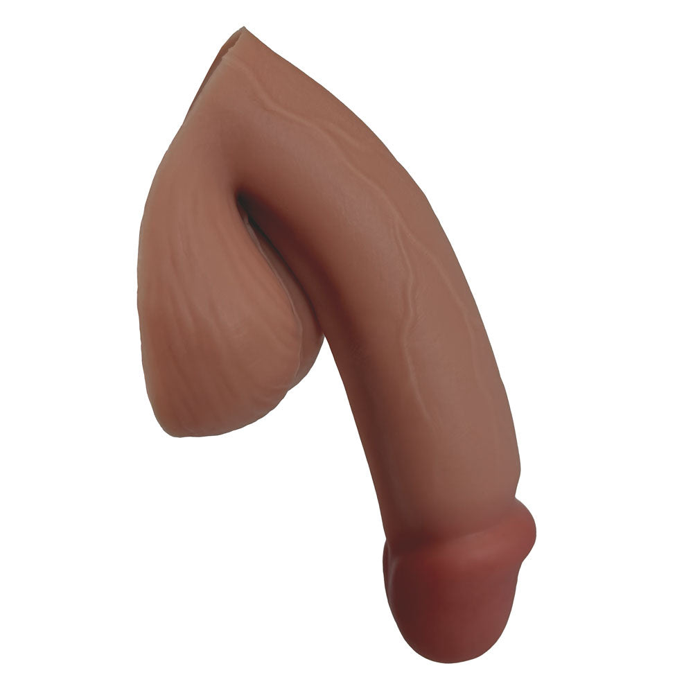 MOCHA SILICONE VECTOR 5 INCH FTM SILICONE PACKER, FROM THE SIDE IN THE PACKED FLACCID POSITION