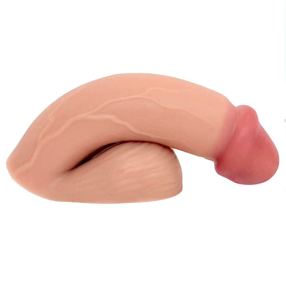 VANILLA SILICONE VECTOR 5 INCH FTM SILICONE PACKER, FROM THE SIDE IN THE PACKED FLACCID POSITION, FLAT ON ITS BASE