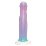 An iridescent silicone dildo with a curved, flared base and a tapered shaft, featuring a pastel gradient transitioning from pink and lavender to light blue, set against a plain white background.