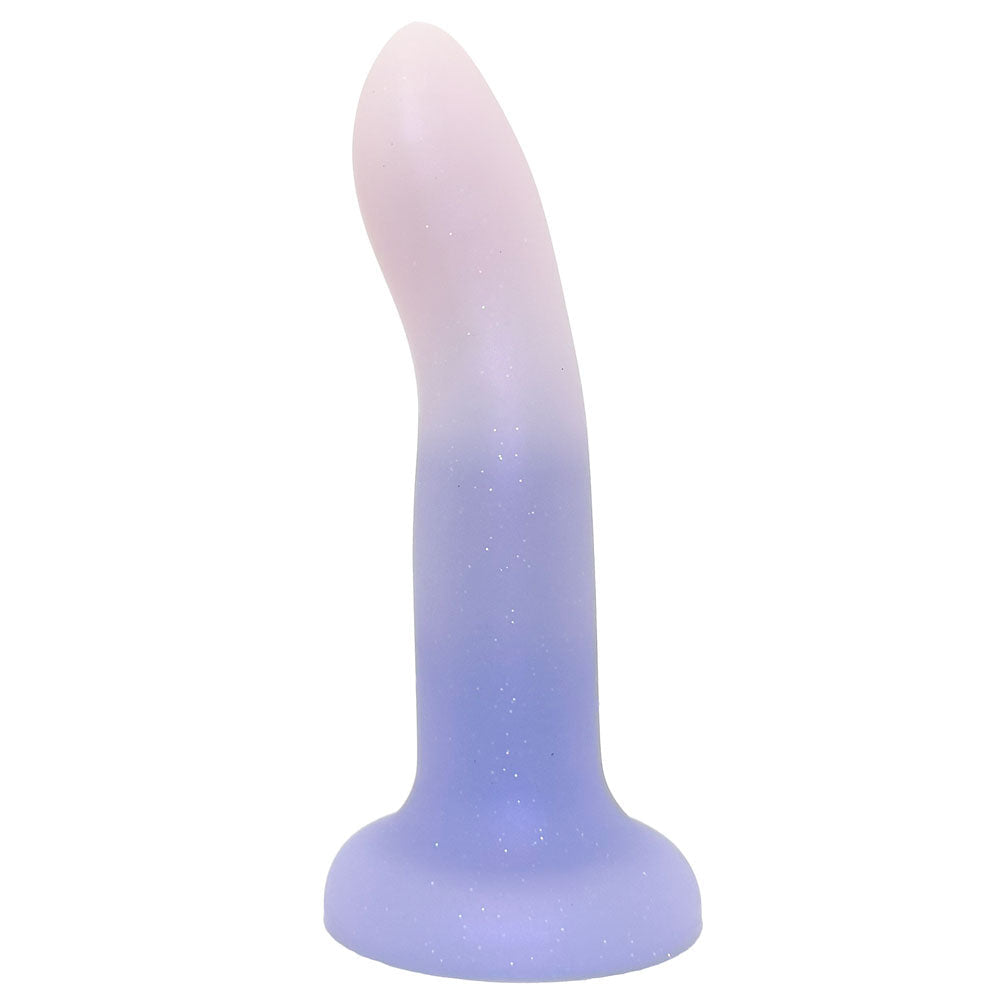 A curved silicone adult novelty product with a glittery finish, featuring a smooth color gradient from pale pink at the top to light purple at the base, isolated on a white background.