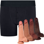 Black boxer briefs shown with four realistic dildos in front, all on a plain white background.