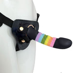 Nexus Fun and Love harness kit with adjustable black strap on harness and Rainbow Prysm tease silicone dildo, with dildo inserted into the harness and harness on a mannequin, angled from the side
