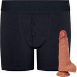 RodeoH Black Button fly boxer harness flat from the front with caramel color of 6" Slyder dildo shown from the side