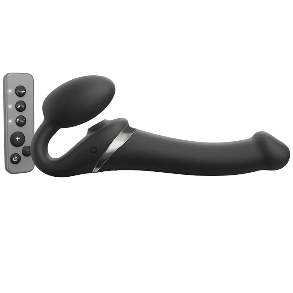 strap on me multi orgasm vibrating silicone strapless strap on dildo in black, size medium, from the side with wireless remote